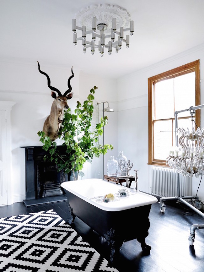 eclectic bathroom with a gorgeous black clawfoot tub