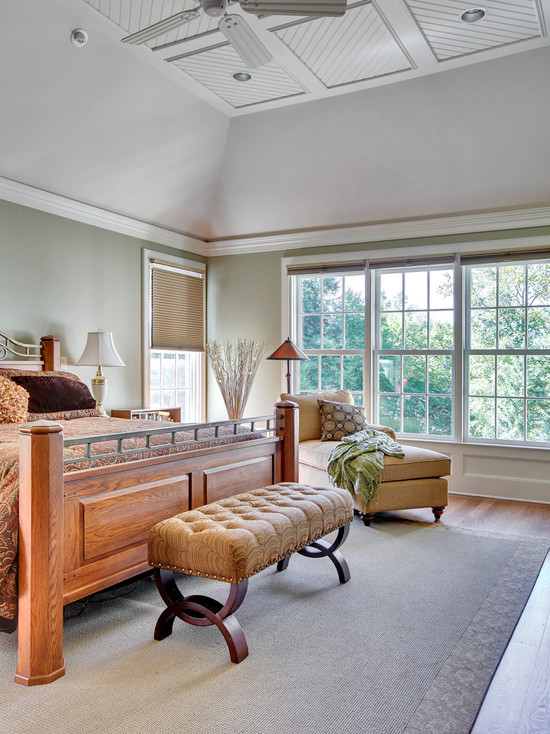 Beautiful Bedroom Design with Tufted Footboard and Cream Chaise at Corner Solid Wood Bedframe Lake House Interior