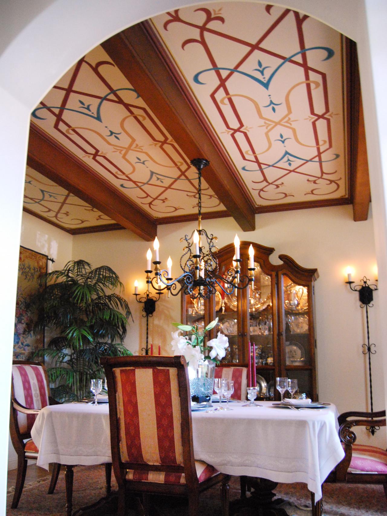 Mediterranean Dining Room With Decorated Ceiling