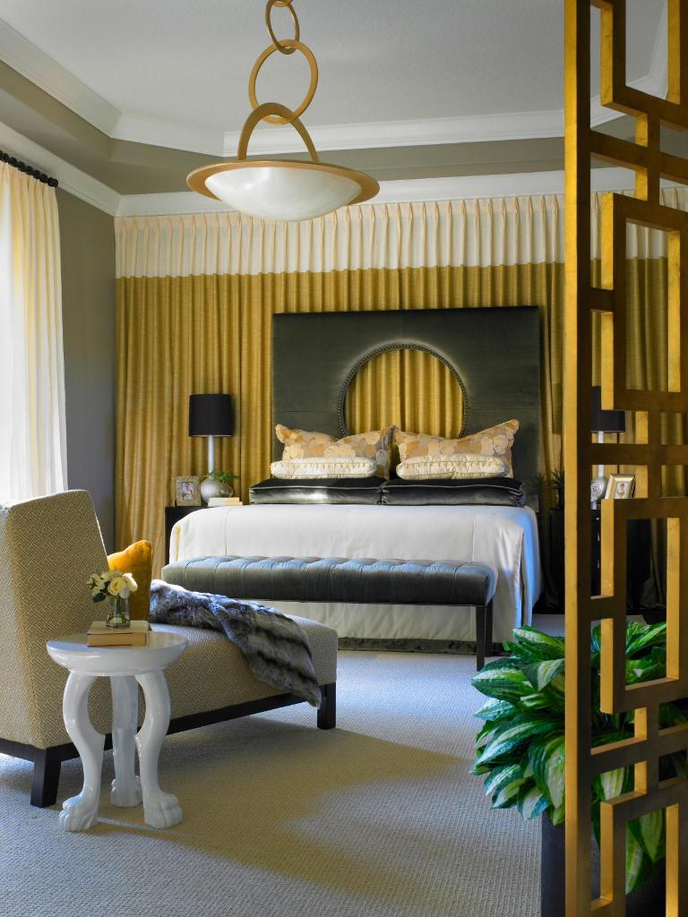 Gold and Gray Bedroom With Curtained Wall