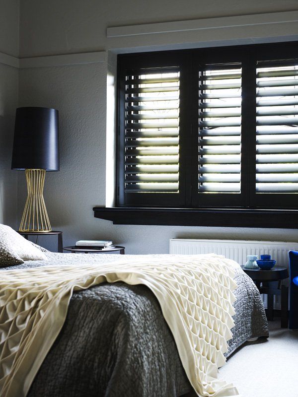 Bedroom with Black Shutters