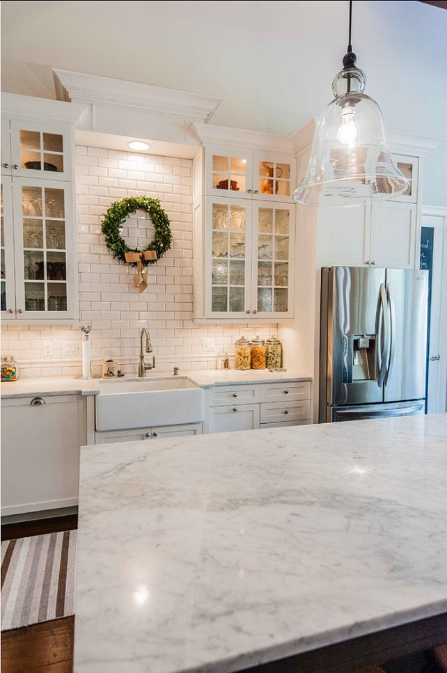 White Kitchen Cabinets with Carrara Marble Countertops