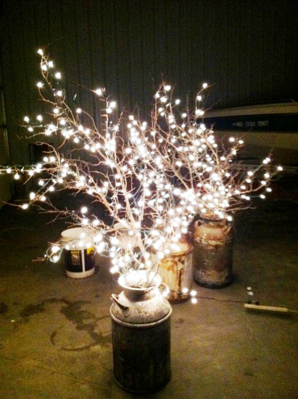 branches-with-lights-in-a-milk-can