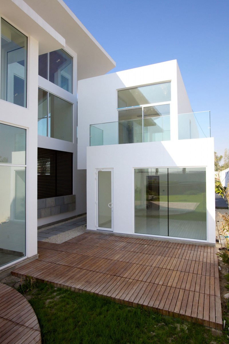 Futuristic home Glass doors Glass railing Wooden deck