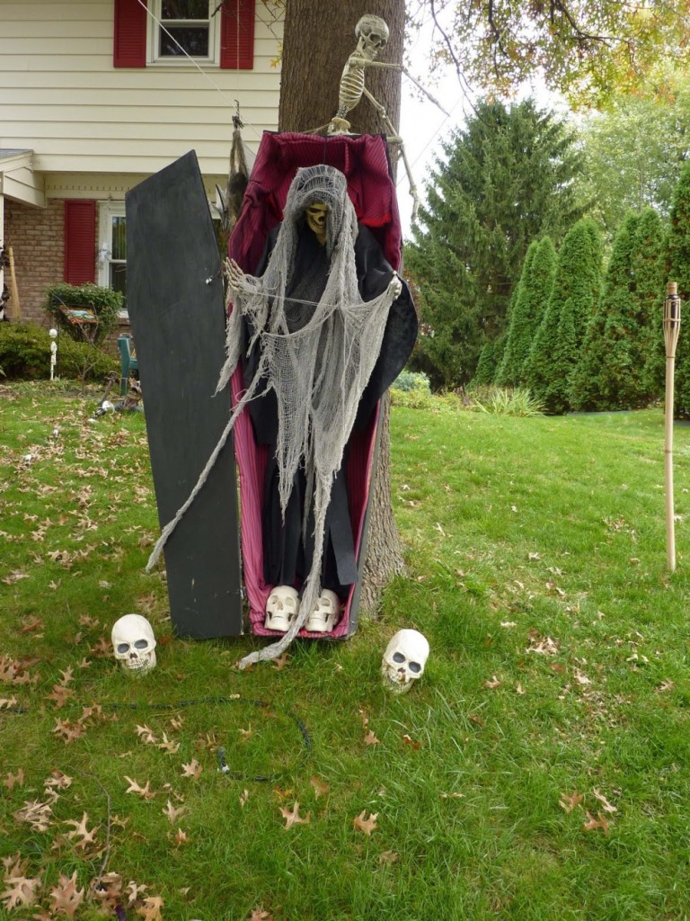 Scary witch dolls on garden featuring inspiring halloween outdoor decoration idea