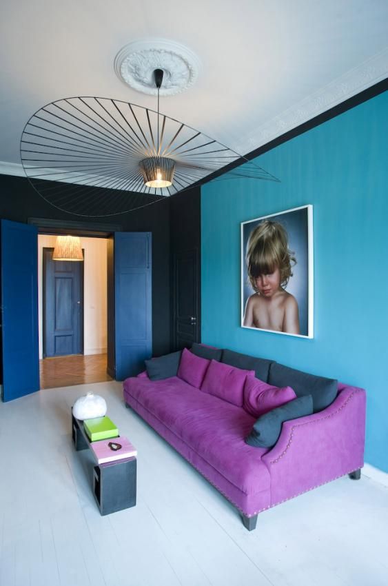 purple-sofa-and-blue-wall